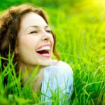 Smiling Woman In Grass