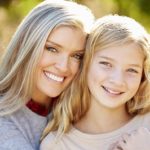 Portrait Of A Mother And Daughter smiling